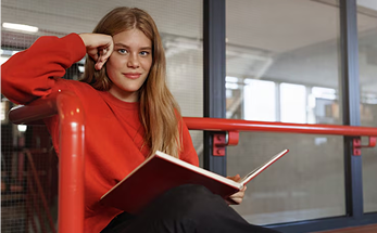 Woman with notebook in modern office
